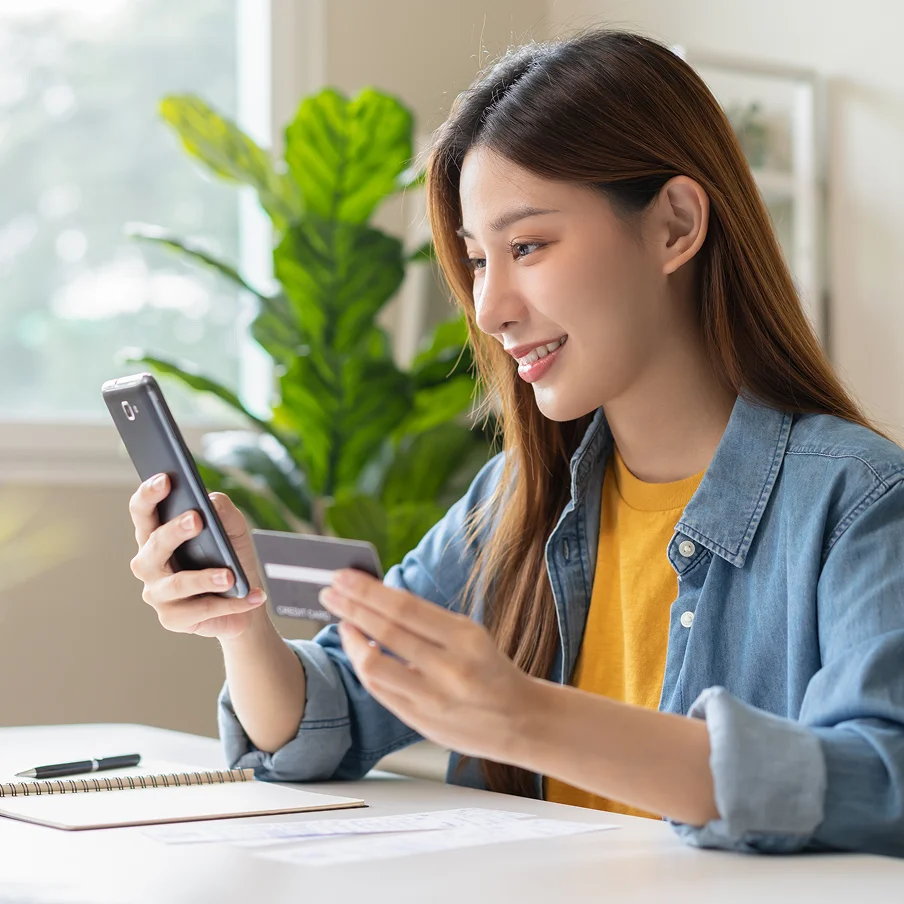 A smiling borrower who's pleased with the convenient repayment channels available with Credit Empire, a top-rated Orchard licensed money lender